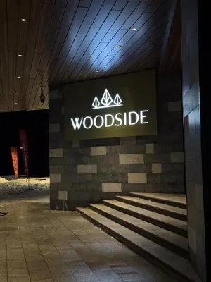 a sign for a woodside sign on a wall at Woodside Kopaonik 212 in Kopaonik