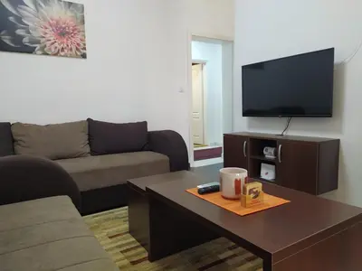 a living room with a couch and a coffee table at ROSA in Vrnjačka Banja