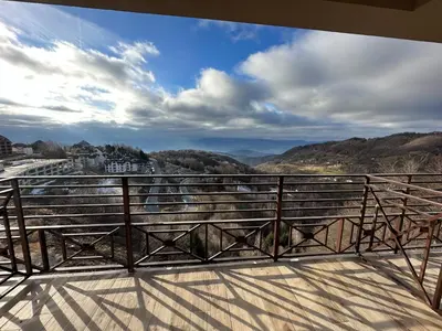 a balcony with a view of the mountains at N Lux 81 - Milmari Resort in Kopaonik