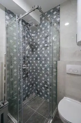 a shower stall in a bathroom with a toilet at Heart of Niš Lux in Niš