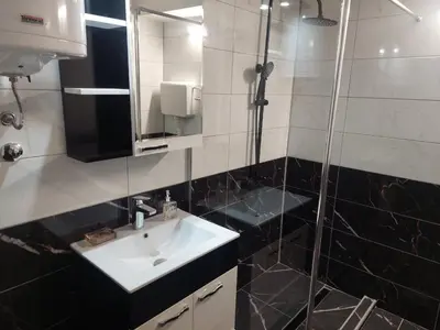 a bathroom with a sink and a shower at Rajna in Pirot