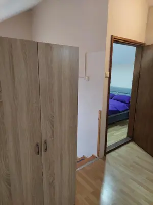 a room with a door and a bedroom with a bed at ASTRA in Pirot