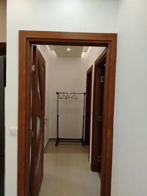 a hallway with two doors and a walk in closet at Apartman Branković Pirot-Zapadni Kej 58 in Pirot