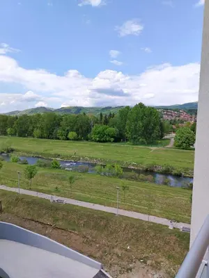 a view of a field and a river at Apartman Branković Pirot-Zapadni Kej 58 in Pirot