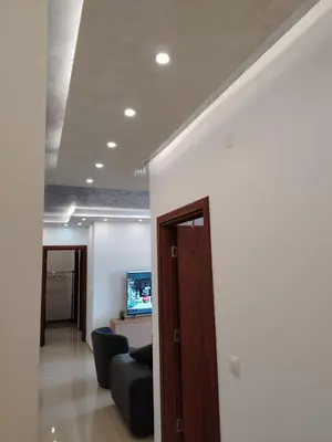 a living room with a couch and a tv at Apartman Branković Pirot-Zapadni Kej 58 in Pirot