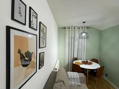 a living room with a couch and a table at Apartman Element in Kruševac