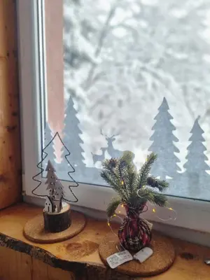 a window with christmas decorations on a window sill at Studio Potocic in Kopaonik