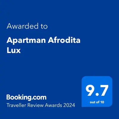 a blue text box with the words awarded to apartmentarian articriclia luk at Apartman Afrodita Lux 1 in Niš