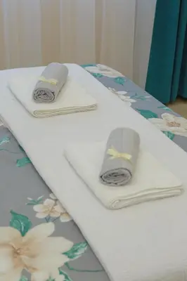 two towels are sitting on top of a table at Vila Harmony in Pirot