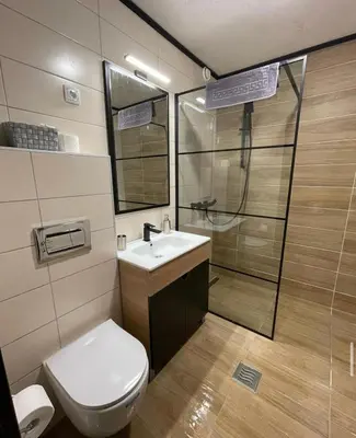 a bathroom with a toilet and a sink and a shower at Suncana Planina Glory-Kop in Kopaonik