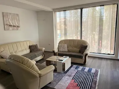 a living room with two couches and a table at Apartman Paradiso in Pirot