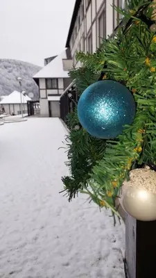 a blue christmas ornament on the side of a building at Apartman Jelka Brzece in Brzeće