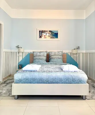 a bedroom with a large bed in a room at Vila Palas in Vrnjačka Banja