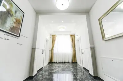 a hallway of a building with a window at Vila Palas in Vrnjačka Banja