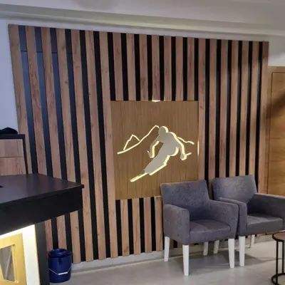 a wall with a picture of a surfer on it at CentralKop in Kopaonik