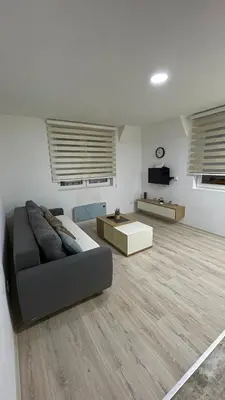 a living room with a couch and a table at Geregs alibi in Kopaonik