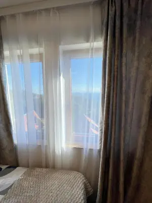 a bedroom with a window with a view of an airplane at Geregs alibi in Kopaonik