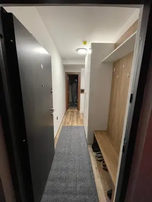 a hallway leading into a room with a door and a hallway at Gencian resort in Kopaonik