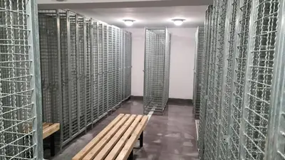 a hallway with a wooden bench in a wine cellar at Apartman BM403 in Kopaonik