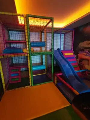 a play room with a slide at Talija Milmari Nlux in Kopaonik