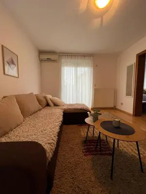 a living room with a couch and a table at Apartman Danica in Vrnjačka Banja