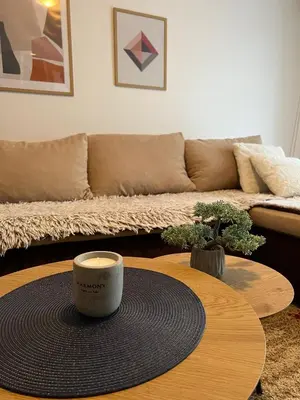 a coffee table in a living room with a couch at Apartman Danica in Vrnjačka Banja