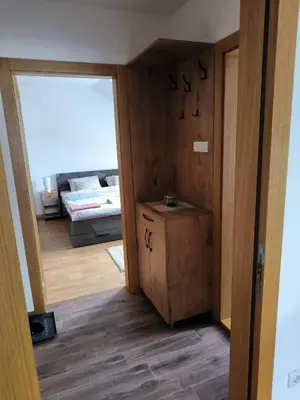 a room with a door open to a living room at Apartman Nađa in Soko Banja