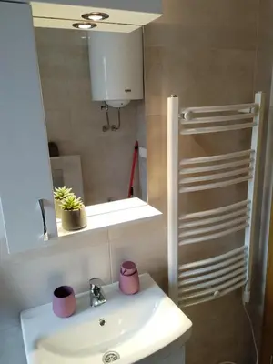 a bathroom with a sink and a mirror at Apartman Nađa in Soko Banja