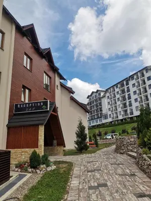 a view of the hotel and the apartment buildings at Golden view apartment P82 - Milmari Apartments & SPA in Kopaonik