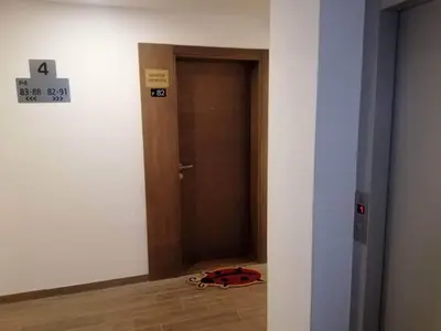a room with a door and a bag on the floor at Golden view apartment P82 - Milmari Apartments & SPA in Kopaonik