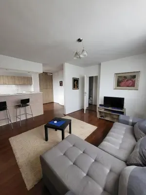 a living room with a couch and a table at Apartman Nina in Niš
