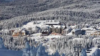 a ski lodge in the middle of a snow covered mountain at Grand Lux Koznik Center in Kopaonik