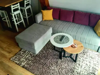 a living room with a couch and a table at White Eagle Kopaonik - Beli Orao in Kopaonik