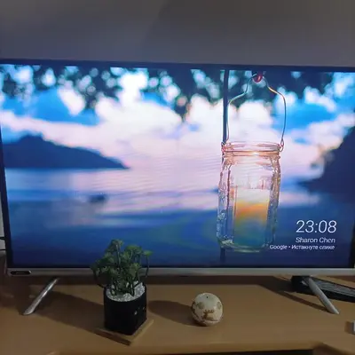 a television screen with a candle in a glass jar at Apartman Vrnjacka zora in Vrnjačka Banja