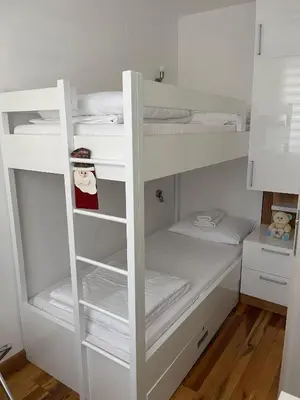 a white bunk bed in a room at Apartman Tea in Kopaonik