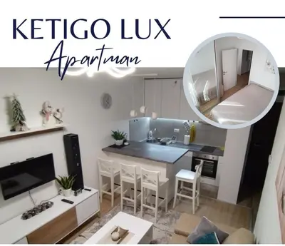 a living room with a kitchen with a mirror at Ketigo Lux in Kopaonik