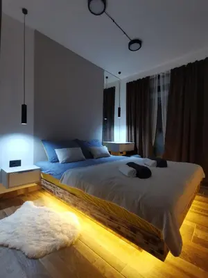 a bedroom with a large bed in a room at Apartman 16 Pancic in Kopaonik