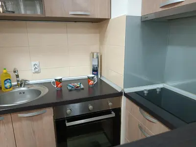 a small kitchen with a sink and a sink at Apartman M & B in Niš