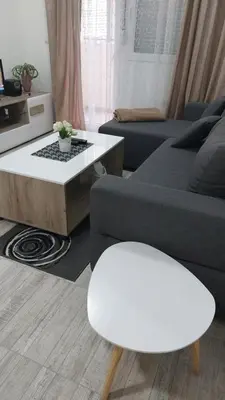 a living room with a couch and a coffee table at Bili 2 in Paraćin