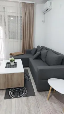 a living room with a couch and a coffee table at Bili 2 in Paraćin