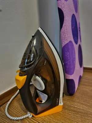 a iron sitting on top of a wooden floor at Grand Blue 2 Bedroom Apartment Sokobanja in Soko Banja