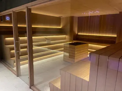 a dining room with wooden tables and benches at Woodside Kopaonik & SPA by Slopeview in Kopaonik