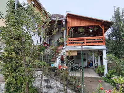 a house with a balcony on the side of it at STD Verice Đorđević in Kalna