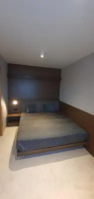 a bedroom with a large bed in a room at MR O Apartments Woodside FREE Parking and SPA Ski in Ski out in Kopaonik