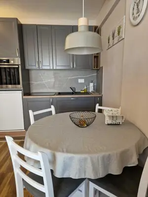a kitchen with a table with a bowl on it at President Kop Apartman Milica in Kopaonik