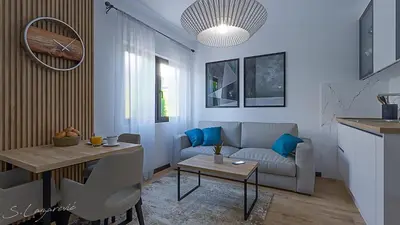 a living room with a couch and a table at Glečer Apartman 6 in Kopaonik