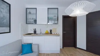 a kitchen with a sink and a counter top at Glečer Apartman 6 in Kopaonik