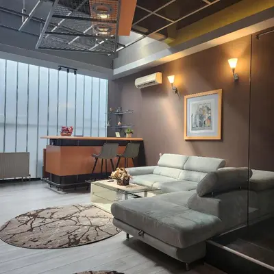 a living room with a couch and a piano at IN CLUB in Vrnjačka Banja