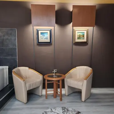 a living room with two chairs and a table at IN CLUB in Vrnjačka Banja