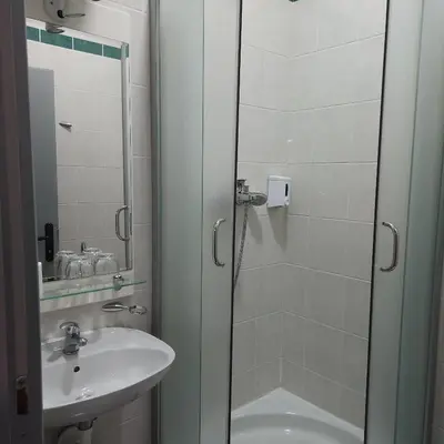 a bathroom with a shower and a sink at IN CLUB in Vrnjačka Banja